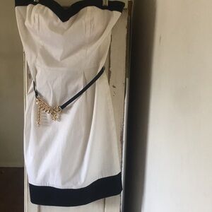 Bebe strapless dress, white and black, line, no tags , never worn  size S/P